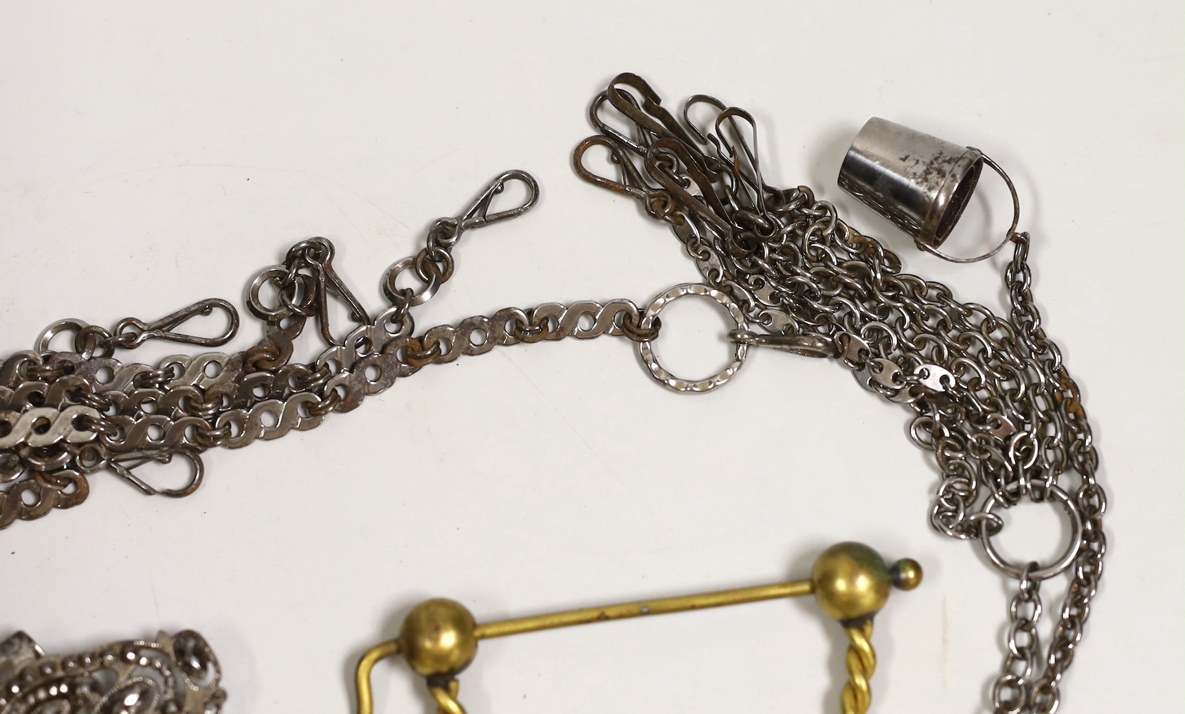 A 19th century cut steel Chatelaine, three others, a similar clasp and a later gilt metal Chatelaine and a cut steel Albert, (7)